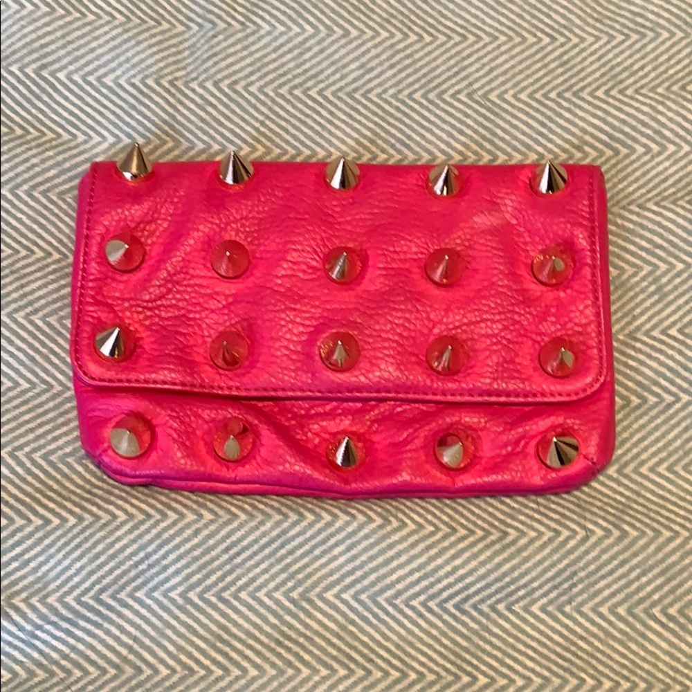 Hot pink spike clutch